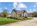 Ranch home with stone accents, landscaping and driveway at 4759 Polo Gate Blvd, Charlotte, NC 28216