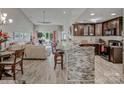 Open kitchen with granite counters and breakfast bar at 18641 Harborside Dr, Cornelius, NC 28031