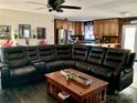 Open living room with sectional sofa and access to the kitchen at 4040 Angus Dr, Gastonia, NC 28056