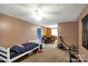 Spacious living room with neutral walls and carpeting at 901 2Nd St, Kings Mountain, NC 28086