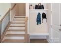 Modern staircase with wooden steps and black metal railing at 2318 Medley Dr, Charlotte, NC 28262