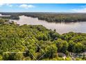 Aerial view showing property near lake and wooded area at 241 Spring Shore Rd, Statesville, NC 28677