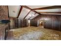 Spacious living room with built-in shelving and fireplace at 6212 Reepsville Rd, Vale, NC 28168