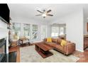 Spacious living room featuring a fireplace and access to backyard at 1001 Serel Dr, Matthews, NC 28104