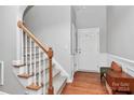 Bright entryway with hardwood floors and a staircase at 1001 Serel Dr, Matthews, NC 28104