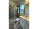 Modern bathroom featuring a walk-in shower and white vanity at 1800 Augustine St, Monroe, NC 28112