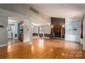 Living room with hardwood floors, fireplace and built-in shelves at 110 Hidden Valley St, Cherryville, NC 28021