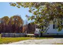 Above-ground pool and house exterior showcasing a side view and porch at 6368 Alley Rd, Catawba, NC 28609