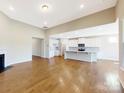 Open concept kitchen and living area with hardwood floors at 120 Brooke Forest Ct, Mooresville, NC 28115