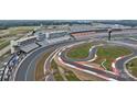 Aerial view showcasing the racetrack and surrounding area at 4721 Morehead Rd # 409, Concord, NC 28027