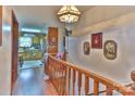 Hallway with wood flooring and view into kitchen at 225 Frye Hts, Taylorsville, NC 28681
