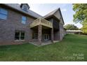 Brick home with a large deck and stone pillars at 1235 Bob Falls Dr, Shelby, NC 28150