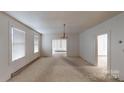 Bright dining room with hardwood floors and chandelier at 309 Elm St, Marshville, NC 28103