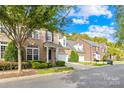 Brick front exterior of charming townhome with landscaped yard at 10320 Berkeley Pond Dr, Charlotte, NC 28277