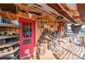 Rustic porch with antique decor and red door at 5067 E Dixon Blvd, Kings Mountain, NC 28086