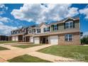 Exterior view of townhome community, featuring multiple units at 5151 Tommy Ln # 1103, Stanley, NC 28164
