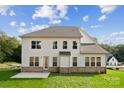 Home's back exterior with patio and grassy yard at 3192 Timber Run Ln, Maiden, NC 28650