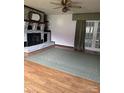 Living room featuring hardwood floors and a brick fireplace at 106 Dons Ct, Shelby, NC 28150