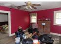 Living room with brick fireplace and needs some updating at 719 Mauney Rd, Stanley, NC 28164