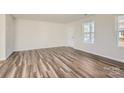 Bright living room featuring light hardwood floors at 1609 Cannonball Ln, Bessemer City, NC 28016