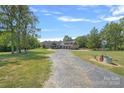 House exterior showcasing a large, inviting front porch and attached garage at 5510 Hoodtown Rd, Sharon, SC 29742