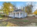 Renovated craftsman home with a large front yard and mature trees at 4319 Hovis Rd, Charlotte, NC 28208
