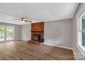 Bright living room with brick fireplace, hardwood floors and access to deck at 511 Colorado Trl, Lincolnton, NC 28092