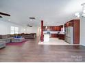 Open concept kitchen with dark wood cabinets and stainless steel appliances at 4616 Canal Rd, Marshville, NC 28103