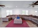 Spacious living room featuring a large sectional sofa and hardwood floors at 4616 Canal Rd, Marshville, NC 28103