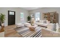 Living room with white couch and black and white rug at 109 Cloninger St, Kings Mountain, NC 28086