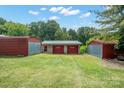 Detached garage with two red doors and a block structure at 504 15Th Se Ave, Hickory, NC 28602