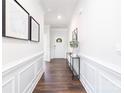 Bright and spacious entryway with hardwood floors and wainscoting at 110 Ari Ave, Troutman, NC 28166