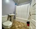 Small bathroom with shower/tub combo and pedestal sink at 84 Walnut Ave, Gastonia, NC 28054