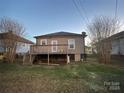 Backyard view with elevated deck and partial view of neighboring home at 84 Walnut Ave, Gastonia, NC 28054