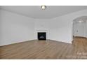 Living room with fireplace and hardwood floors at 129 Eden Ave, Mooresville, NC 28115