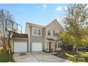 Two-story house with gray siding, two-car garage, and basketball court at 5051 Meanna Dr, Clover, SC 29710