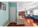 Open living room with hardwood floors and view of kitchen at 5051 Meanna Dr, Clover, SC 29710