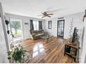 Bright living room with hardwood floors, comfy couch, and access to backyard at 330 Crocker Rd, Kings Mountain, NC 28086