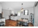Eat-in kitchen with white cabinets and wood-look floors at 330 Crocker Rd, Kings Mountain, NC 28086