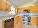 Kitchen with stainless steel appliances and wood cabinets at 1205 Danielle Downs Ct, Concord, NC 28025