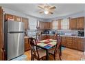 Cozy kitchen with wood cabinets, stainless steel appliances, and dining area at 900 Alma Ave, Kannapolis, NC 28081