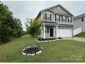 Two-story house with gray siding and a two-car garage at 229 Lake George Dr, Shelby, NC 28152