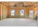 Interior view of a house under construction with exposed framing at 4202 Old Monroe Marshville Rd, Wingate, NC 28174