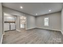 Living room with grey walls and wood-look flooring at 314 S Government St, Lincolnton, NC 28092