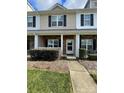 Townhome exterior with front porch and landscaping at 4327 Kobuk Ln, Charlotte, NC 28269