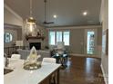Spacious living room with stone fireplace and hardwood floors at 1 Beth Haven Church Rd, Denver, NC 28037