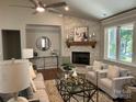 Living room with stone fireplace and neutral decor at 1 Beth Haven Church Rd, Denver, NC 28037