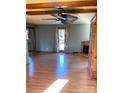Living room with hardwood floors, ceiling fan and fireplace at 1610 Sierra Rd, York, SC 29745