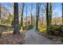 Long driveway leading to a teal ranch home at 702 Forest Hill Dr, Shelby, NC 28150