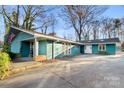 Teal ranch home with a spacious driveway at 702 Forest Hill Dr, Shelby, NC 28150